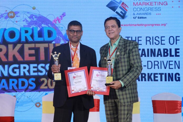 Mr. Puneet Vidyarthi - Head of Brand Marketing, CASE Construction Equipment, APAC & India receiving the Best Integrated Campaign Award for ‘CASE Ka Bharosa’ at World Marketing Conclave & Awards