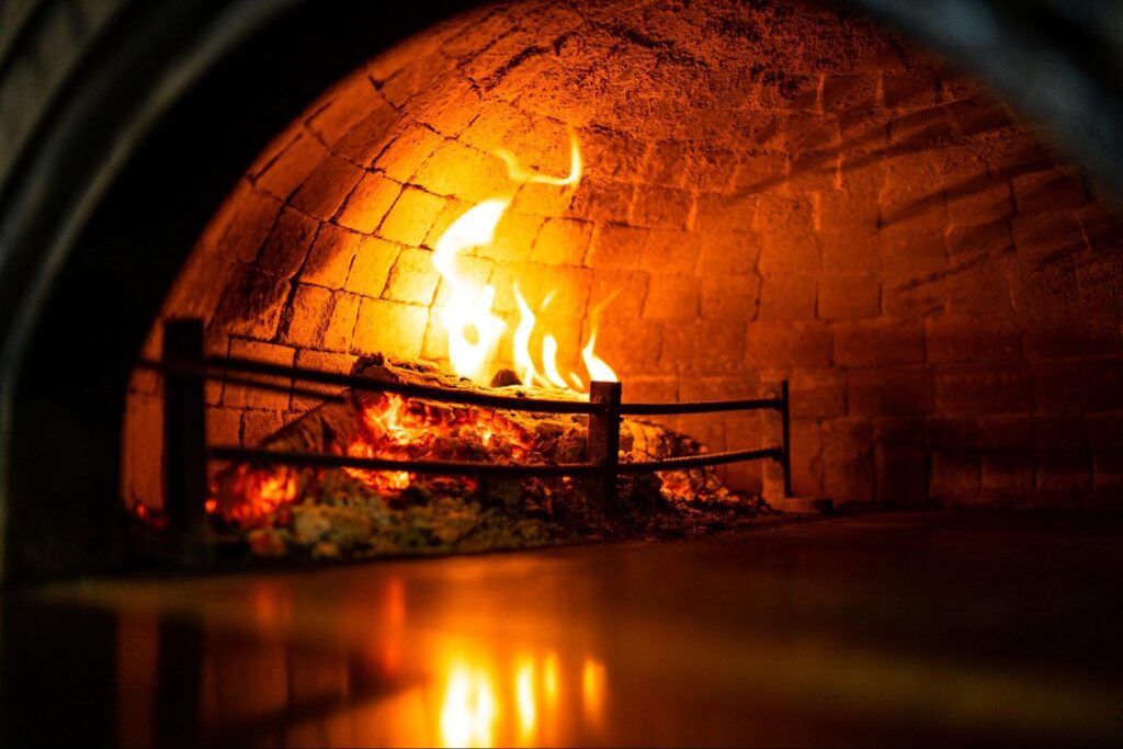 inside of a wood-fired pizza oven